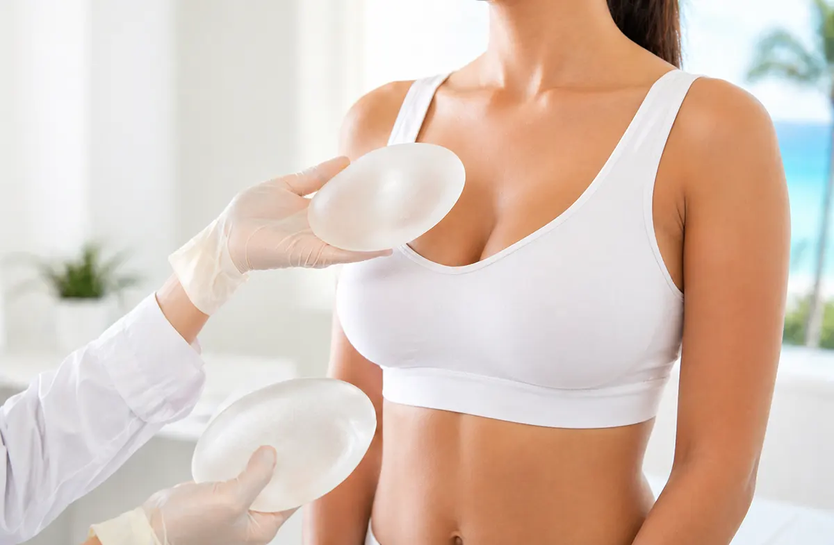 Breast augmentation consultation with breast implants in a female patient evaluating size and shape with a plastic surgeon in Cancun